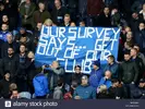 everton-fans-with-a-banner-in-the-stands-that-says-our-survey-says-get-out-of-our-club-during...webp