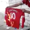 Liverpool-fans-burn-Coutinho-shirt-before-hes-even-left-the-club.webp