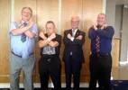 West-Ham-irons-pose-with-Chairman_Aug-2014-.webp