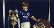 0_Steven-Gerrard-as-a-young-boy-wearing-an-Everton-kit.webp