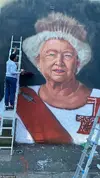 62470381-11218359-A_larger_than_life_painting_of_the_late_Queen_Elizabeth_has_been-a-205_16633...jpg