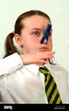 girl-wafting-hand-with-peg-on-her-nose-with-a-bad-smell-A52J3C.webp