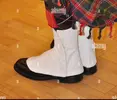 boots-of-scottish-bagpipe-player-surrey-england-united-kingdom-CRWR15.webp