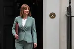 Rachel_Reeves_exiting_downing_street_in_green_suit.webp