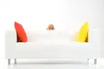 man-peeping-behind-sofa-3208768.webp