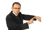 nervous-man-pointing-at-watch-3-25-11.webp