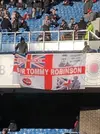 Rangers-fans-Tommy-Robinson-flag.webp